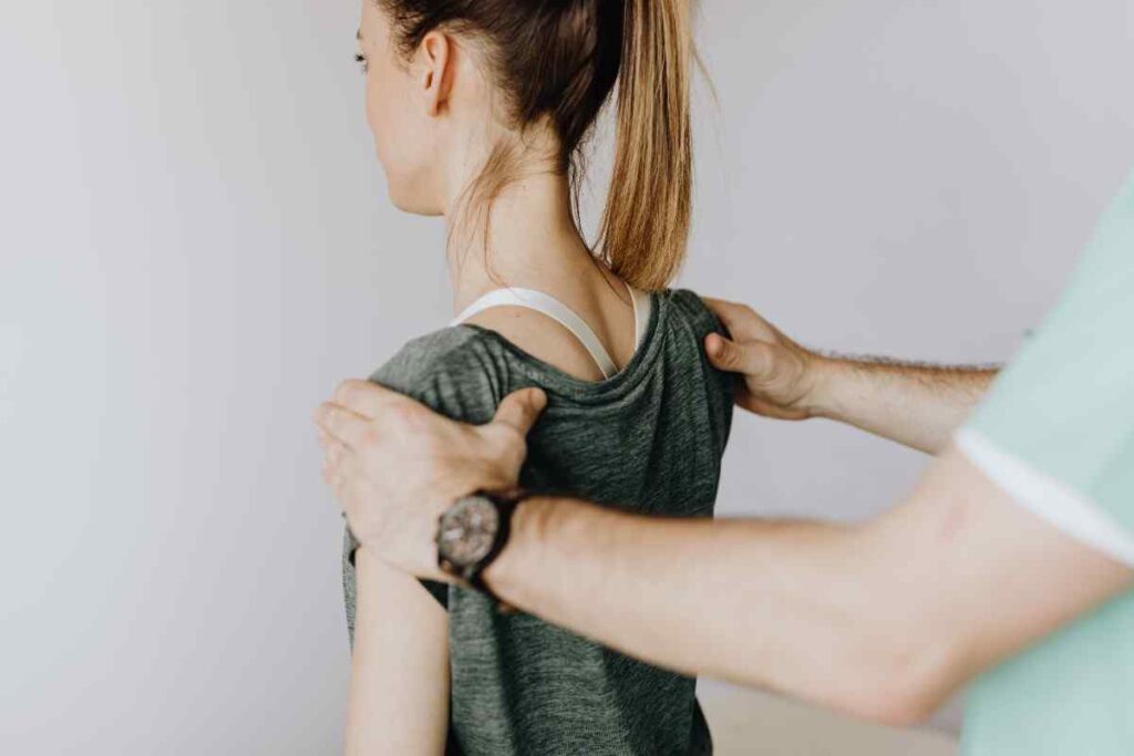 Physiotherapist performing frozen shoulder treatment to improve shoulder mobility and reduce pain