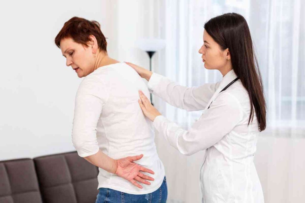 Physiotherapist demonstrating posture correction techniques to improve spinal alignment and reduce back pain